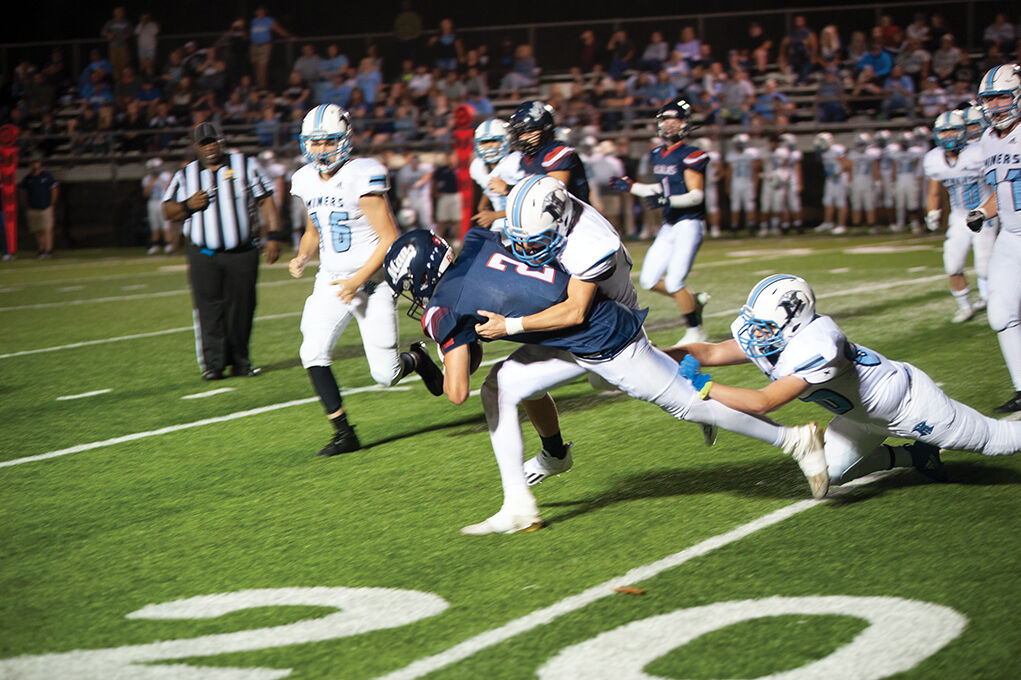 9-23 Mingo Two Miners combining on a tackle.jpg